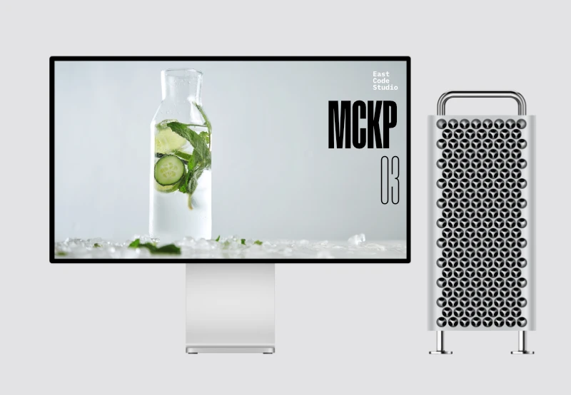 Ein schlanker, moderner Computermonitor zeigt ein erfrischendes Bild einer Glasflasche, gefüllt mit Wasser, Gurkenscheiben, Limettenschnitzen und Minzblättern, umgeben von Eiswürfeln und verstreuten Minzblättern. Rechts neben dem Monitor steht ein silberner Computertower mit einer markanten Frontblende im Wabenmuster. Der Hintergrund ist sauber und hellgrau, wodurch die Produkte besonders gut zur Geltung kommen.