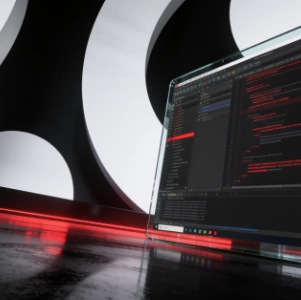 Eine Nahaufnahme aus niedriger Perspektive eines transparenten Laptop-Bildschirms, auf dem rote Codezeilen vor dunklem Hintergrund zu sehen sind. Der Laptop steht auf einer reflektierenden, dunklen Oberfläche, unter der horizontal ein leuchtend roter Lichtstreifen verläuft. Im Hintergrund sorgt eine große, abstrakte, schwarz-weiße Struktur mit kreisförmigen Ausschnitten für eine dramatische, futuristische Kulisse. Die Beleuchtung ist stimmungsvoll und betont den leuchtend roten Code sowie das schlanke, moderne Design der Szene.